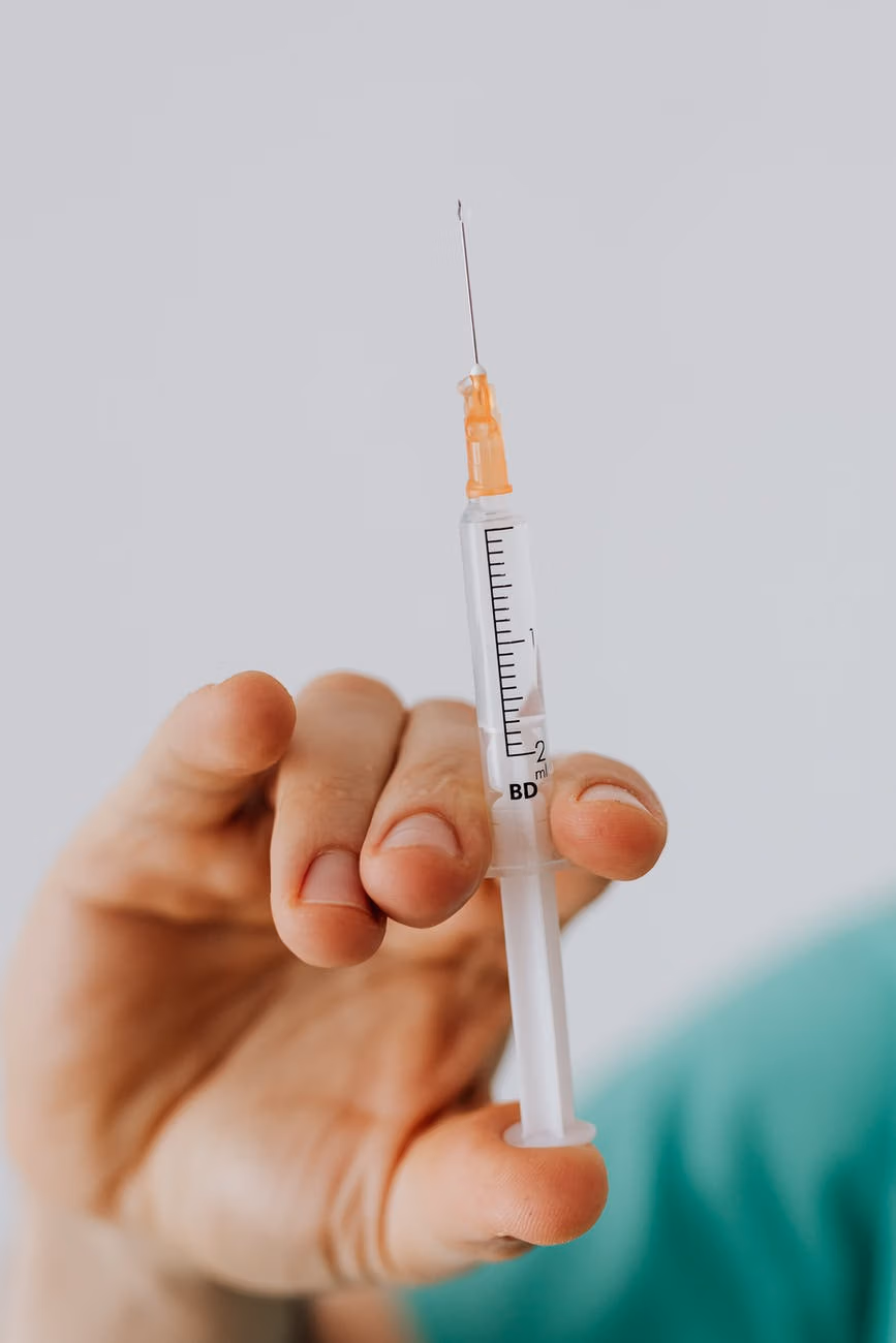 close up view of person holding a vaccine